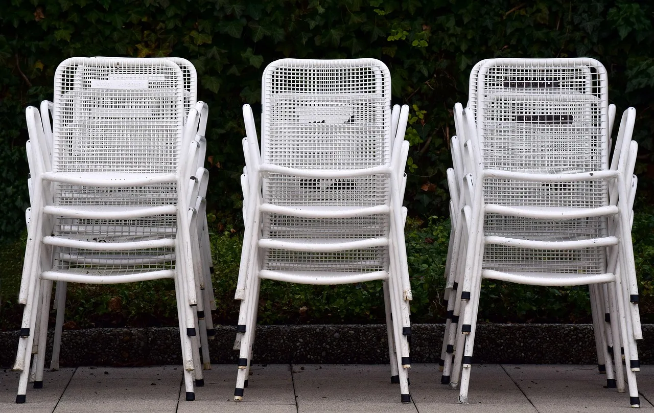 garden chairs, white, metal, stacked, seating, garden, clean up, chair, empty, seat, wood, nature, furniture. Party rental expansion: four directions and what breaks first