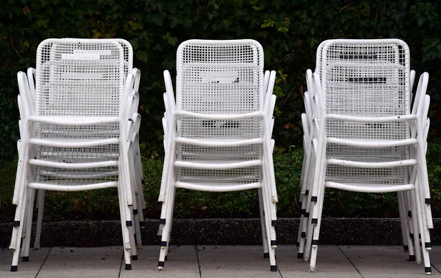 garden chairs, white, metal, stacked, seating, garden, clean up, chair, empty, seat, wood, nature, furniture. Party rental expansion: four directions and what breaks first